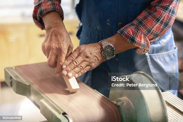 Man Sanding A Piece Of Wood Stock Photo - Download Image Now - Construction Worker, Sweden, Adult