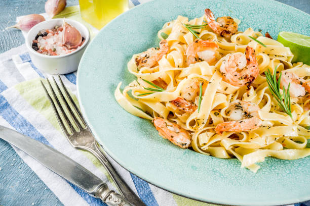 istock Pasta fettuccine with shrimp 1034265210