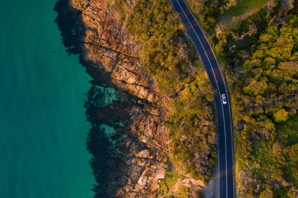 Mount Martha Coastal Road Aerial Aerial photograph of the Mount Martha coastal drive located in the Mornington Peninsula. drone car on road stock pictures, royalty-free photos & images