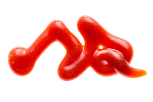 istock Close up tomato sauce ketchup isolated on white background 1034269538