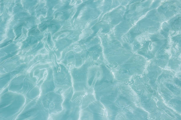 istock Shining light and reflections of blue water 1034269688