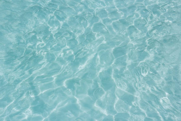 istock Shining light and reflections of blue water 1034269780
