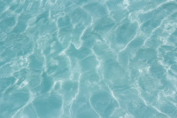istock Shining light and reflections of blue water 1034269836