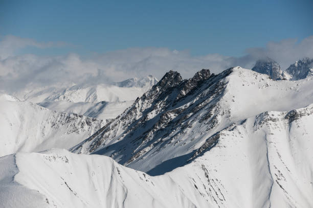 istock Beautiful view of high mountains under the clouds 1034270242