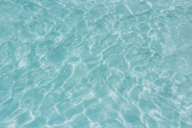 istock Shining light and reflections of blue water 1034270408