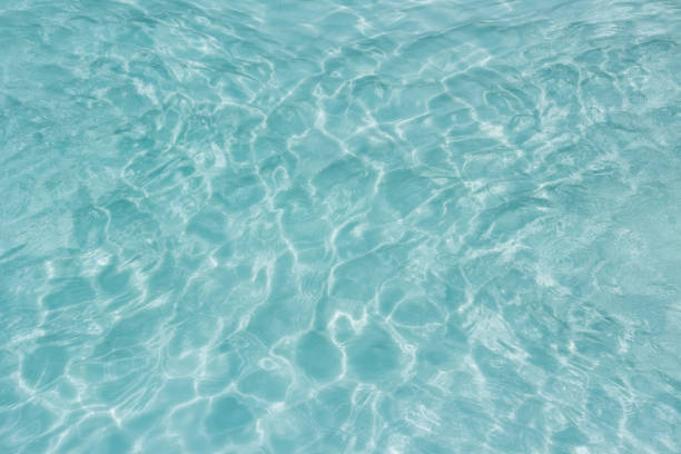 istock Shining light and reflections of blue water 1034273970