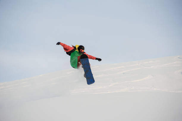 istock Professional snowboarder jumping on the powder snow 1034274762