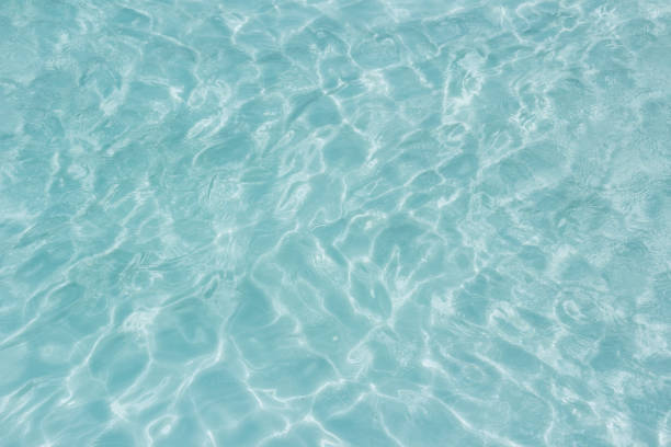 istock Shining light and reflections of blue water 1034274874