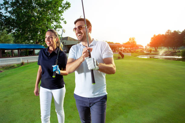 istock Golfing couple on the putting green at the golf course 1034274900