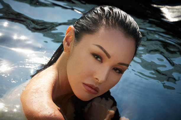 young beautiful asian woman bathing at seaside