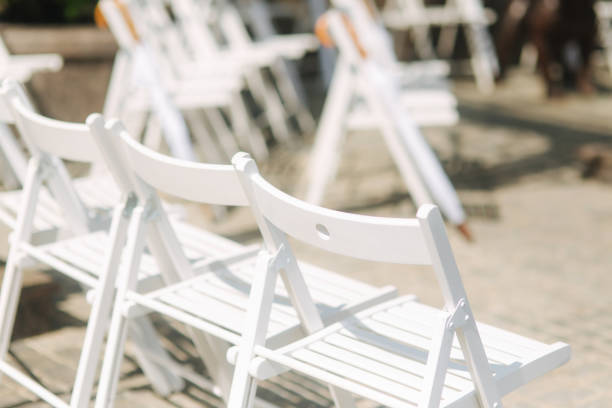 istock White chair with white umbrella. Wedding ceremony 1034275112