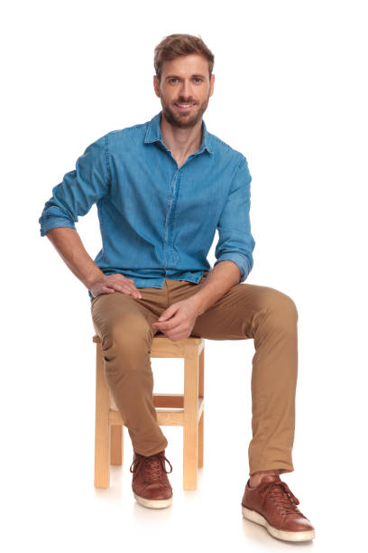 istock young casual man taking a break, sitting on a chair 1034275128