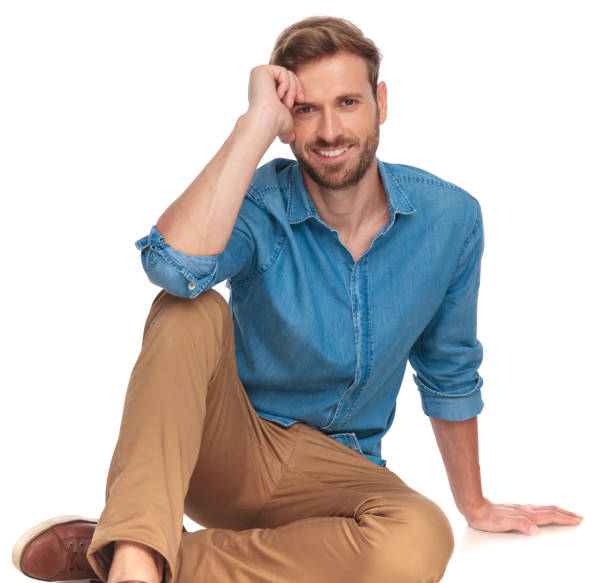 istock laughing young casual man lying down 1034275604