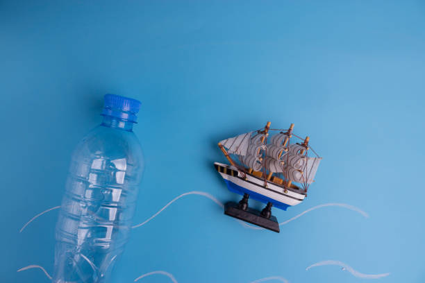istock ocean Pollution concept. plastic bottles on blue background 1034275836