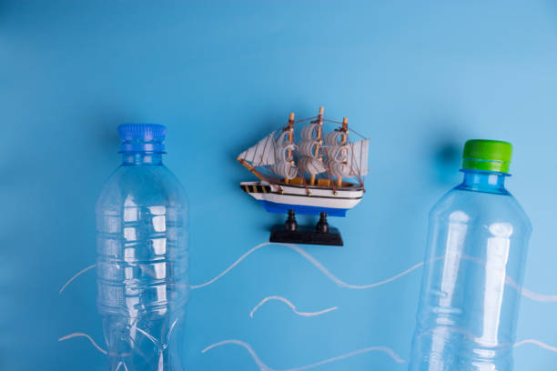 istock ocean Pollution concept. plastic bottles on blue background 1034275860