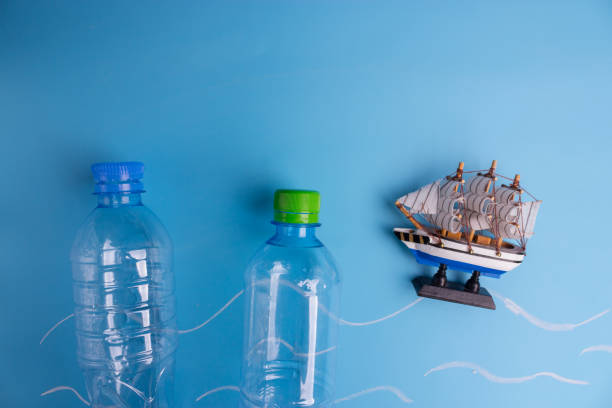 istock ocean Pollution concept. plastic bottles on blue background 1034275878