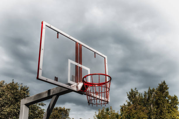 istock Basketball ring on a background of thunderclouds 1034276002