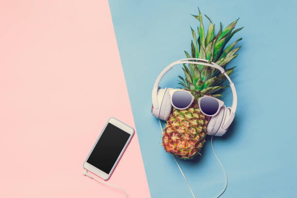 istock pineapple on colored paper with glasses 1034280216
