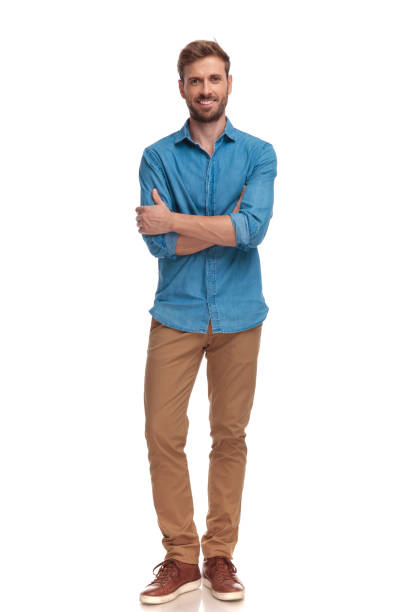 istock confident smiling casual man with hands crossed 1034282992