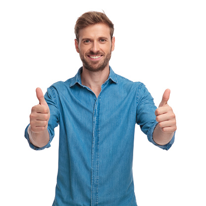 happy casual man makes the ok sign on white background