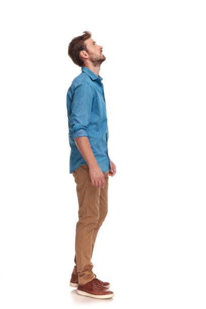istock side view of a casual man looking up at something 1034283206
