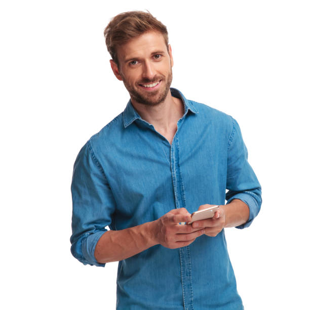 istock smiling casual man texting on his mobile phone 1034283558