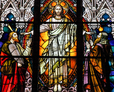 Stained glass window depicting Jesus Christ, Moses with the Ten Commandments and the Prophet Iesaiah, in the cathedral of Schwerin, Germany