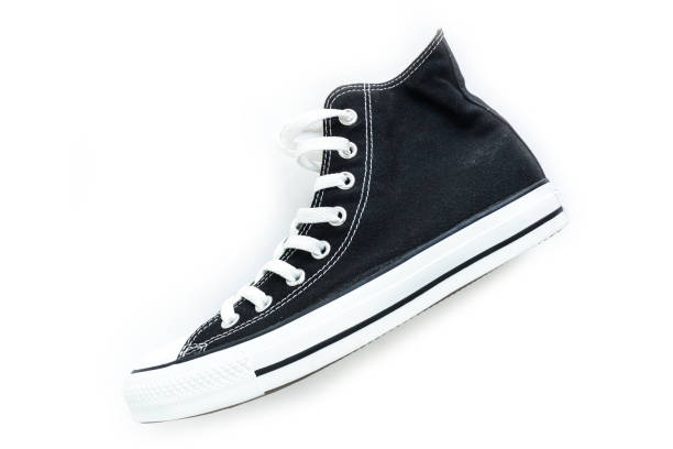 istock black sneakers classic vintage shoe on white background 1034284162