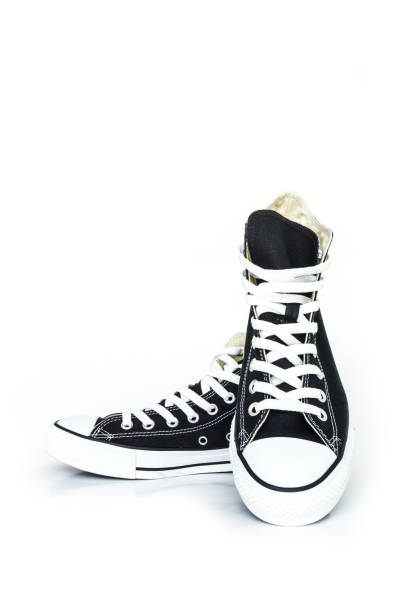 istock black sneakers classic vintage shoe on white background 1034284192