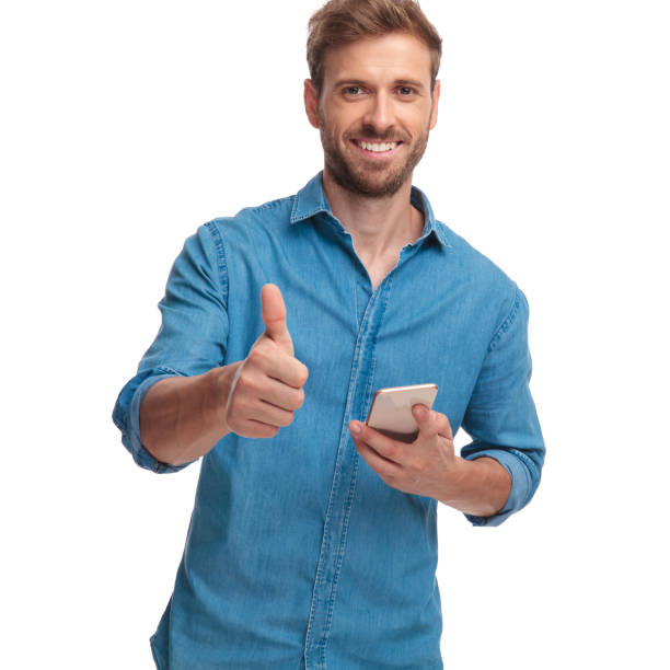 istock man reading good news on his phone and makes ok 1034284252