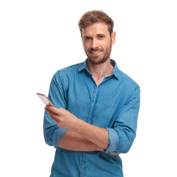 istock young casual student writes sms message on his mobile phone 1034284278