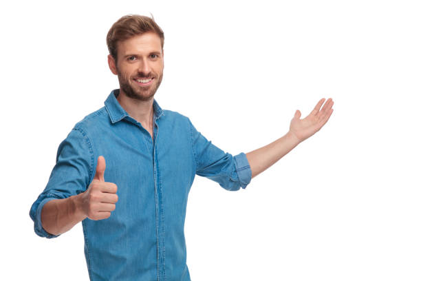 istock smiling young casual man presenting and making the ok sign 1034286824