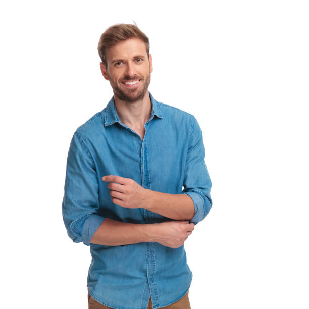 istock happy young casual man fixing his sleeve 1034287096