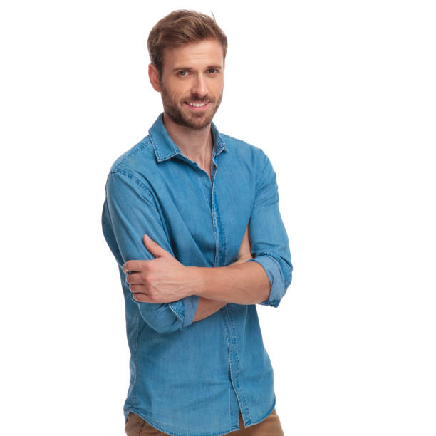 istock confident young casual man with arms folded 1034287110