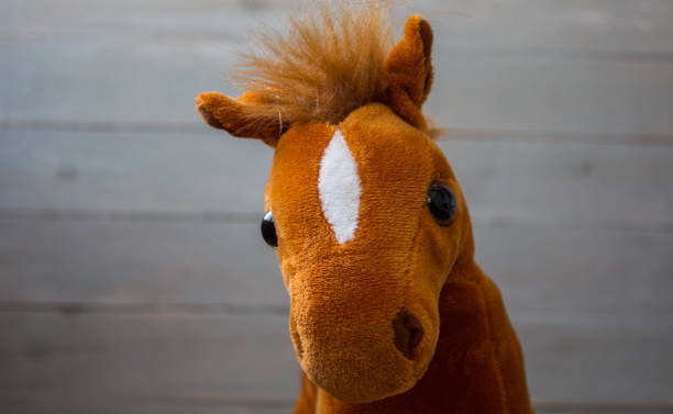 istock a beautiful red horse with a saddle kid toy 1034287196