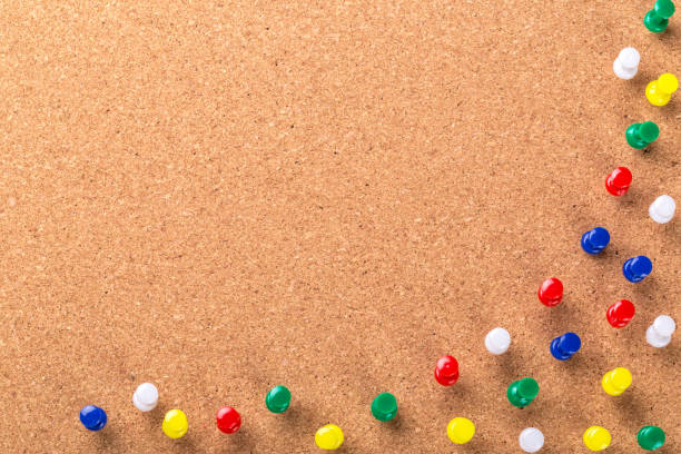 istock Pin board texture for background and colorful pins 1034294840