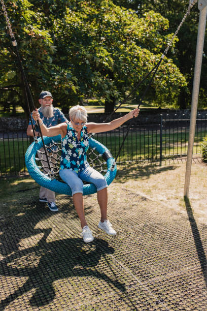 istock Older Couple Playing in Park 1034298000