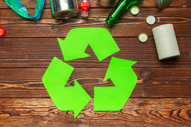 istock Eco concept with recycling symbol on table background top view 1034298266