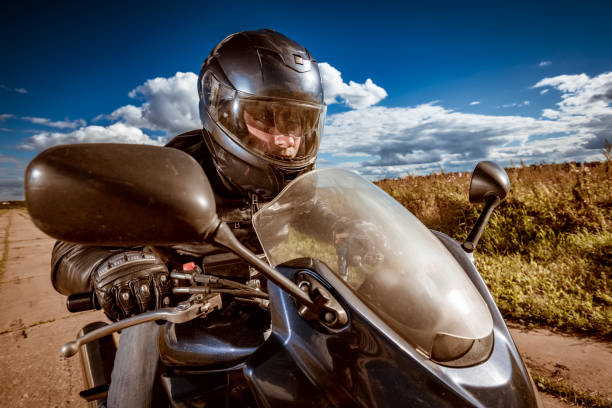 istock Biker racing on the road 1034301894