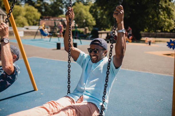 istock Senior Man Having Fun at Park on the Swing 1034302078
