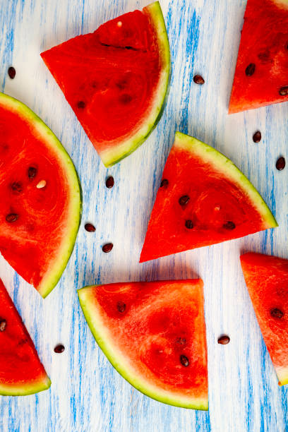 istock Pieces of watermelon on a blue table. 1034309866