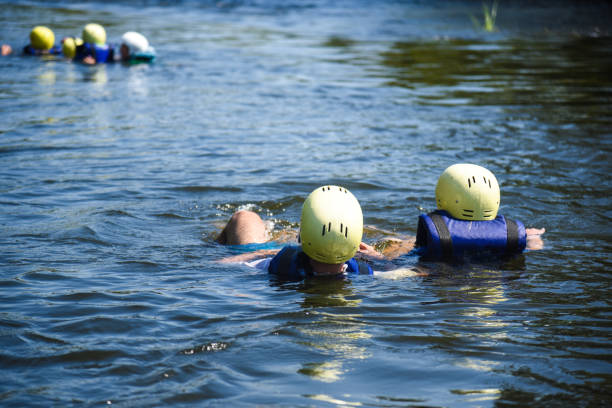 istock people in water in helmets and vests 1034310236