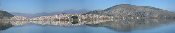 Reflection of Kastoria in lake Orestiada , Greece