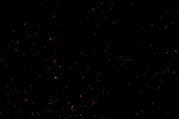 istock bonfire spark in the dark sky in night, shallow focus 1034310738