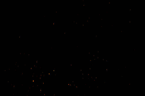 istock bonfire spark in the dark sky in night, shallow focus 1034310752