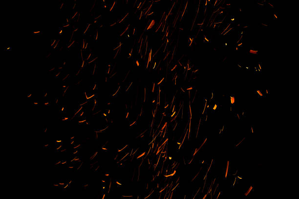 istock bonfire spark in the dark sky in night, shallow focus 1034310778