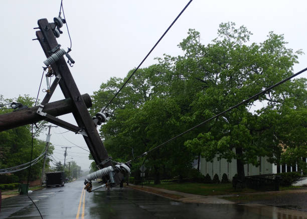 istock The storm caused severe damage to electric poles falling tilt. 1034313532