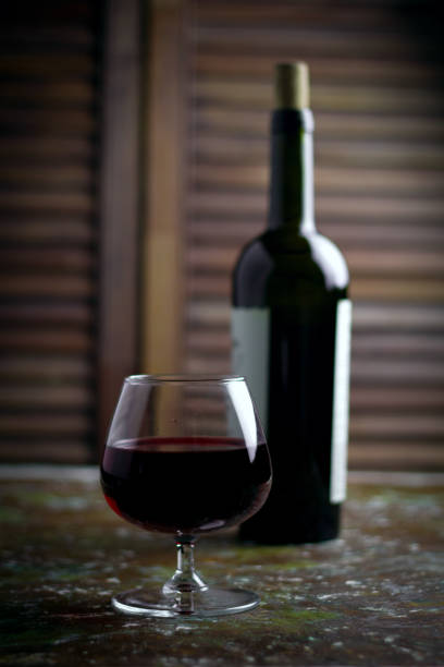 istock wine glass with expensive red wine 1034317806