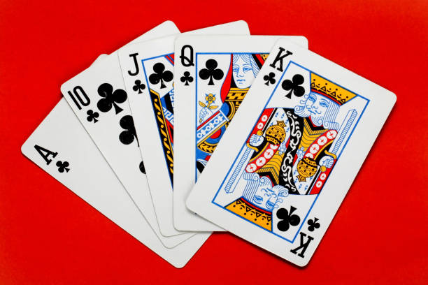 Poker royal flush isolated  on red background