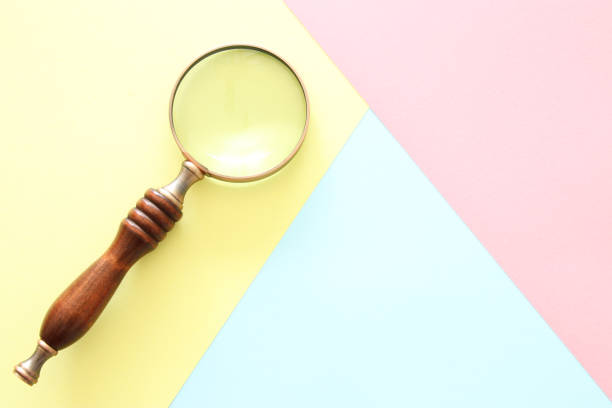 istock Abstract pastel colored paper texture. Minimal geometric shapes and lines. trendy design concept. vintage magnifying glass 1034317868